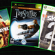 The covers for Max Payne 3, Timesplitters 2 and Skate 2 in front of a black background.